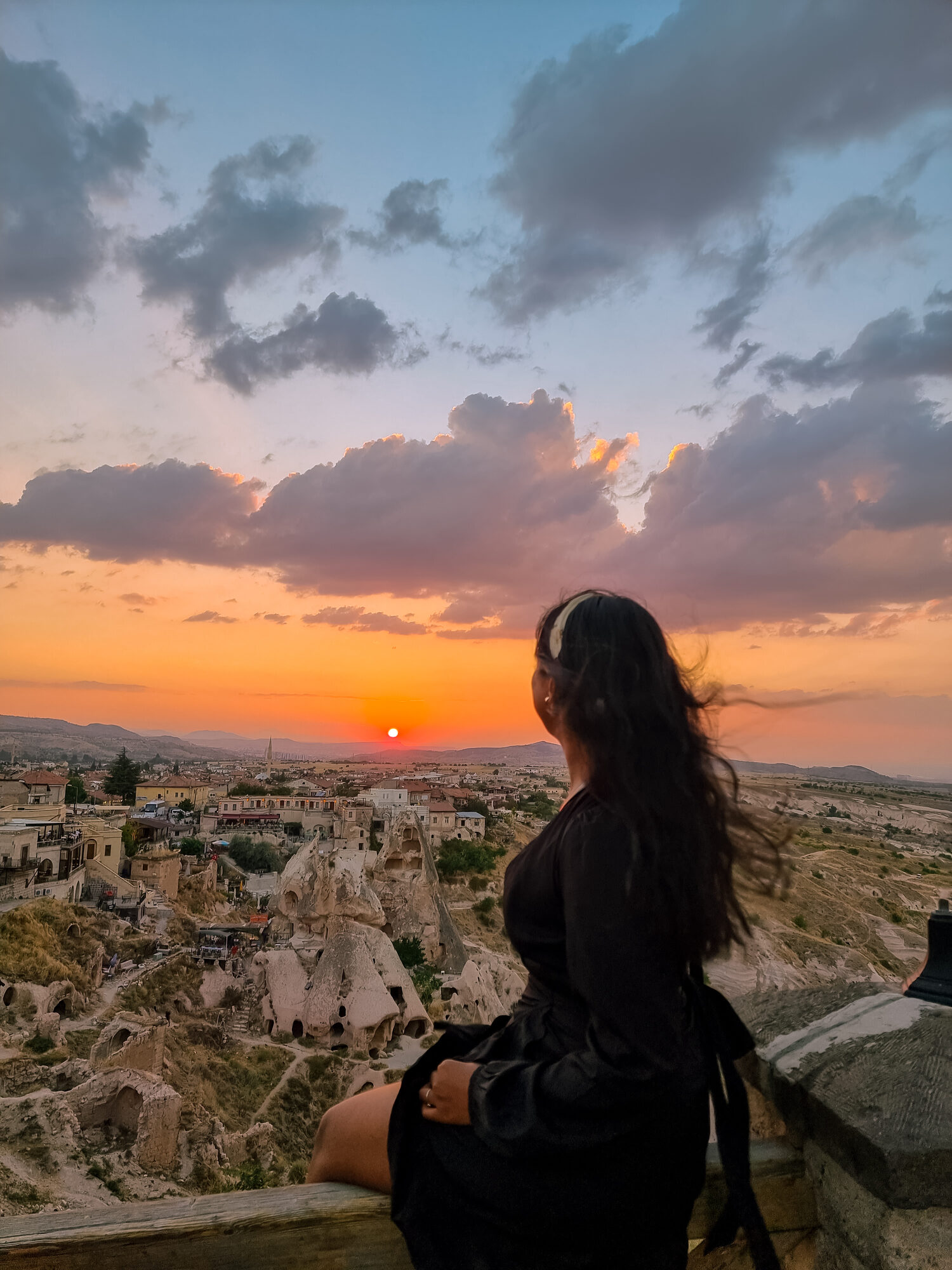 Portrait travel photo at sunset over a valley