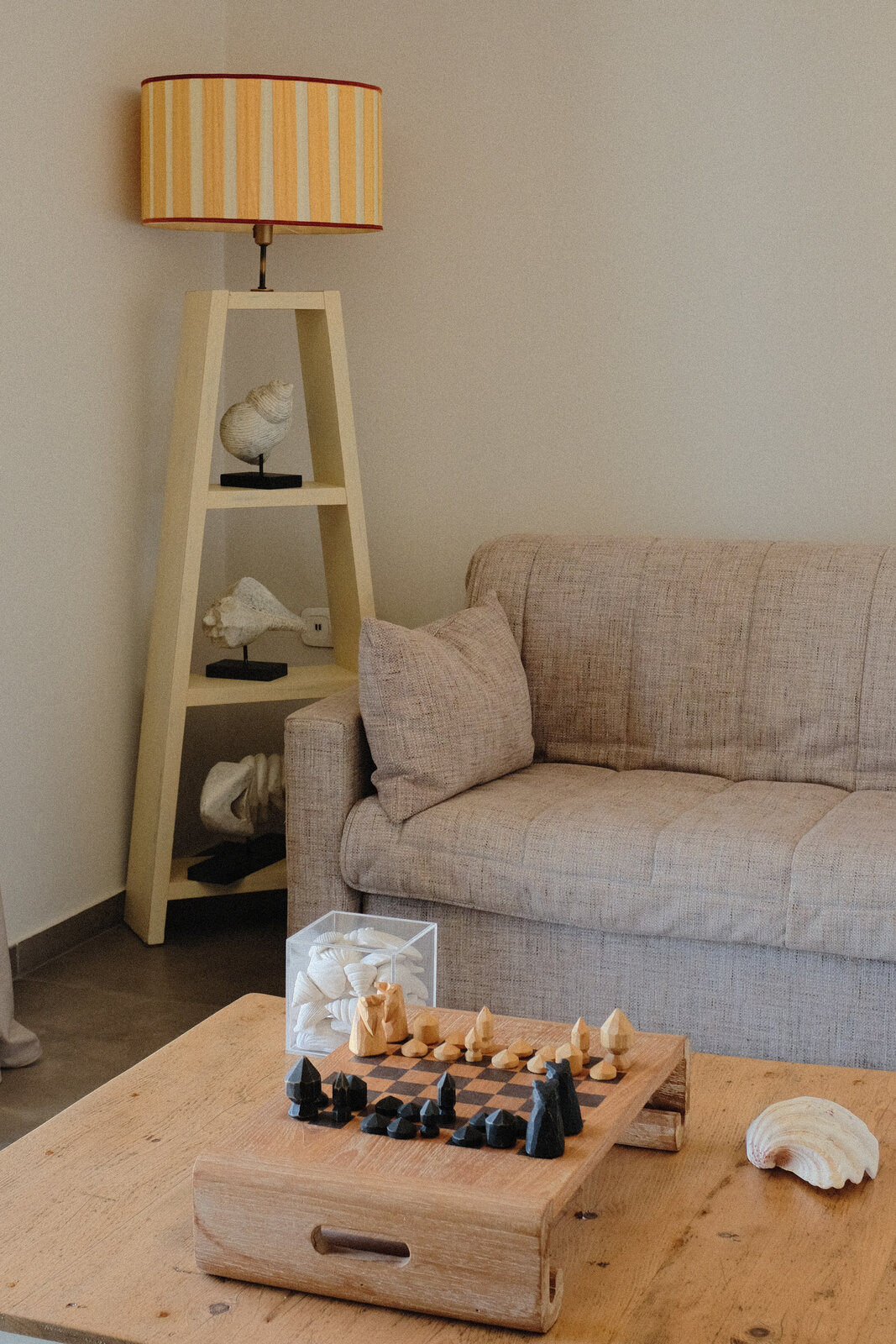 Villa living room with sofa and a wooden chess set
