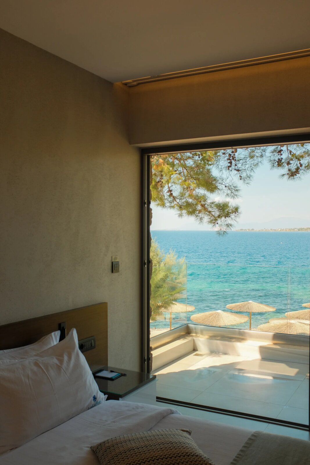 Hotel room bed with a sea view terrace